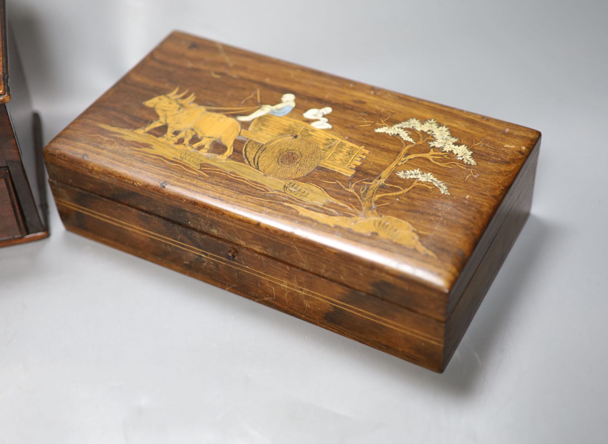 An aneroid barometer together with a 19th century mahogany coffee grinder and an inlaid box